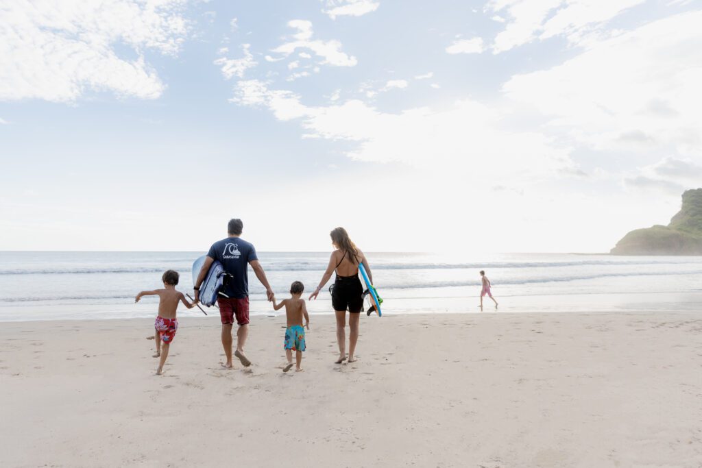 family surfing on playa los perros I rancho santana