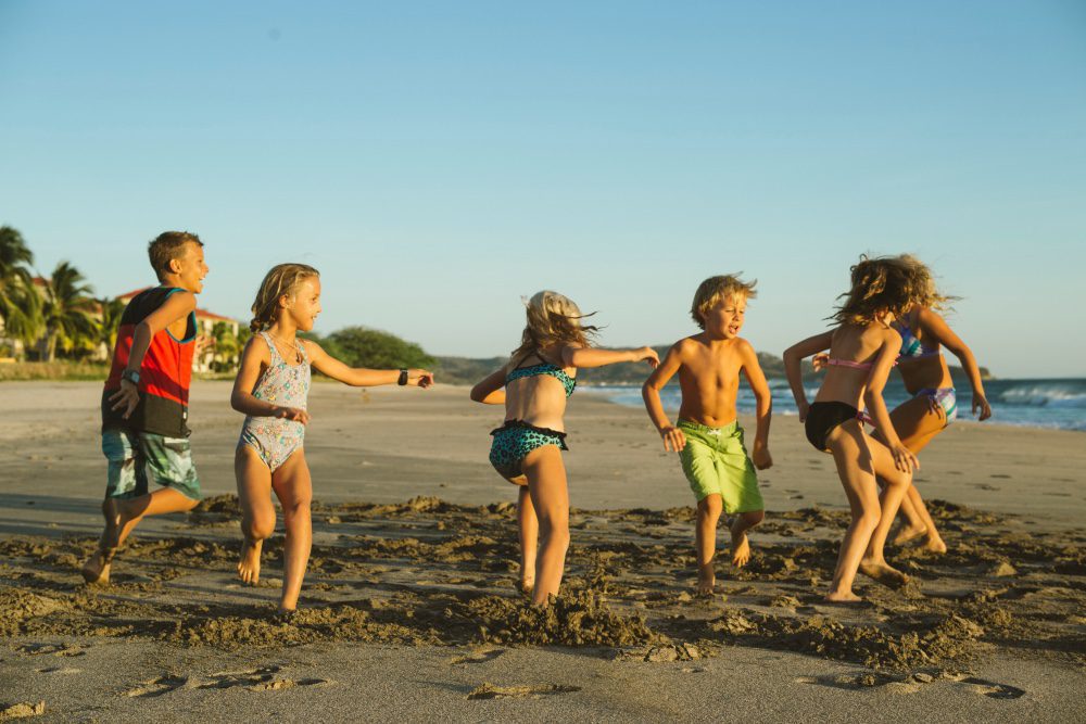 view of kids playing on the beach resort rancho santana