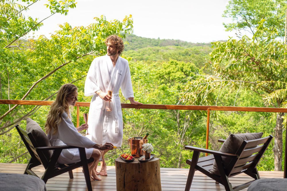 A couple enjoying the calming effects of the green spaces at Rancho Santana