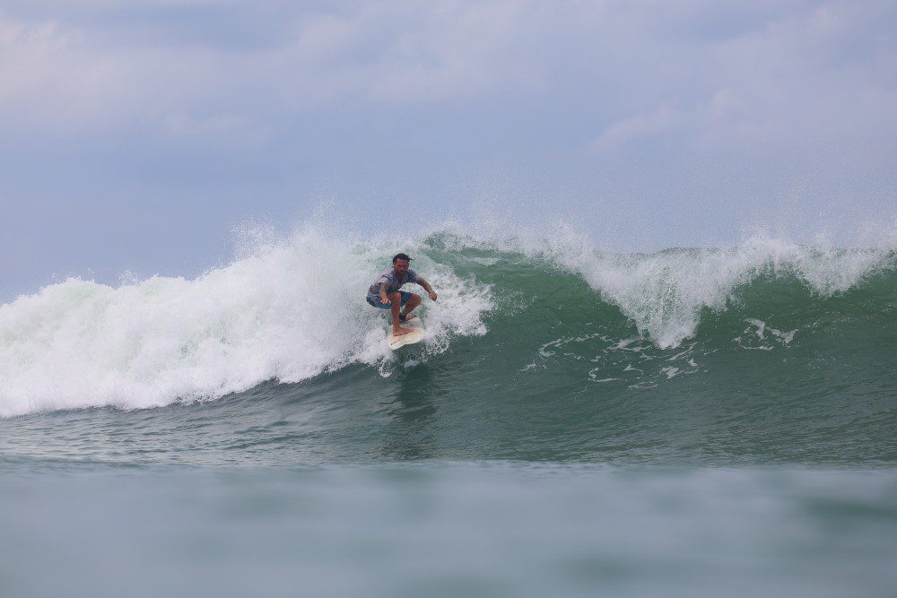 picture of a surfer on the emerald coast of Nicaragua surfing with Rancho Santana surf teachers