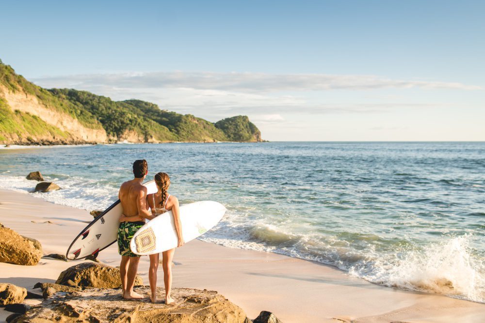 Beach resort goers taking surf lessons at Rancho Santana.