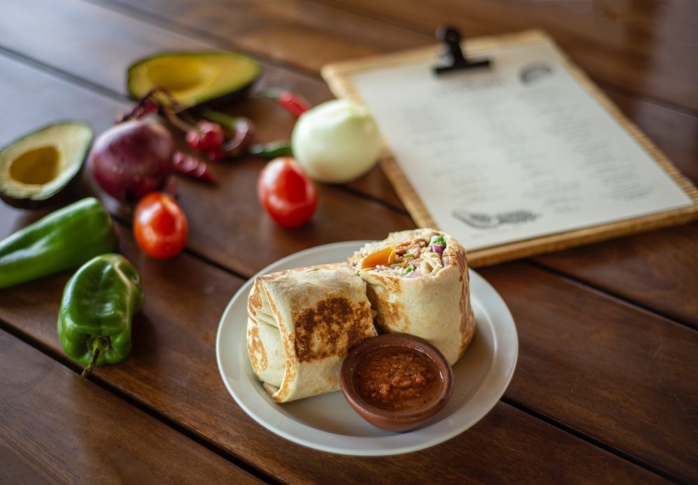 Nicaragua's dish on a plate made with spices such as cumin, garlic, onion, and peppers.