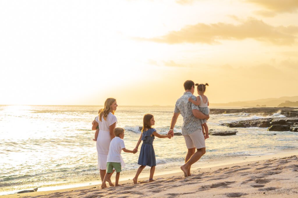 family walking on the beach of Playa Rosada at rancho santana